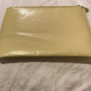 Cream-colored Pottery Barn clutch